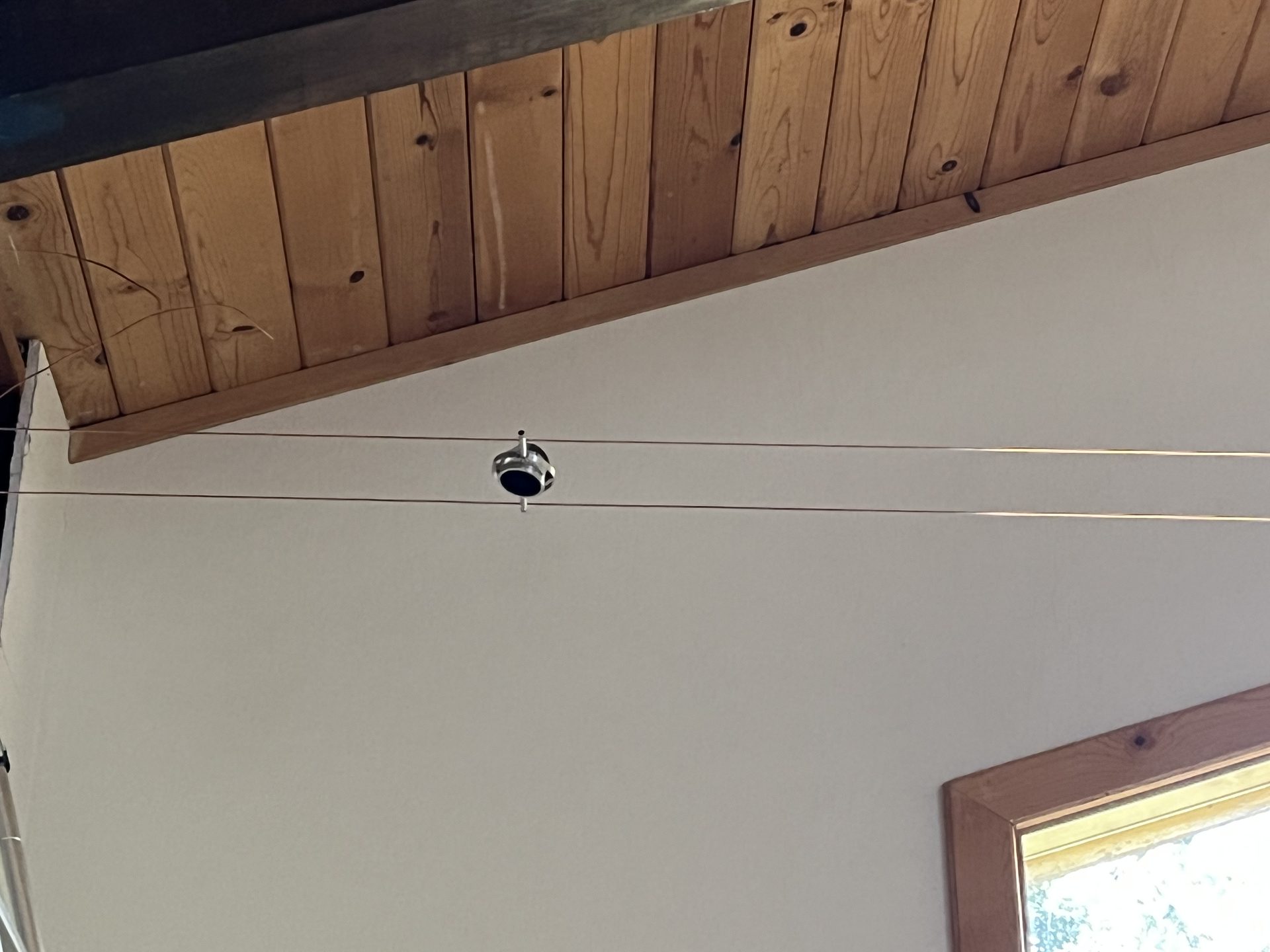 Clean cable runs integrated into a wood-plank ceiling