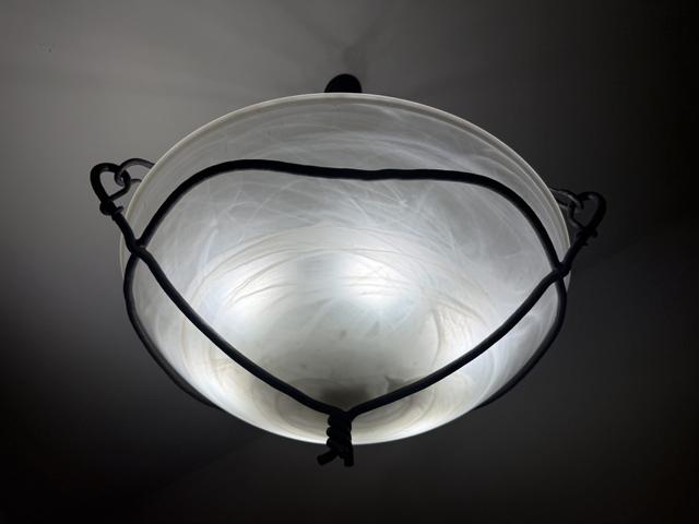 Hand-blown glass shade in a hand-forged iron cradle — built to order