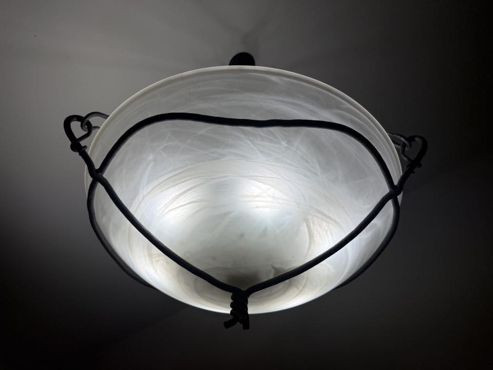 Hand-blown glass shade in a hand-forged iron cradle — built to order