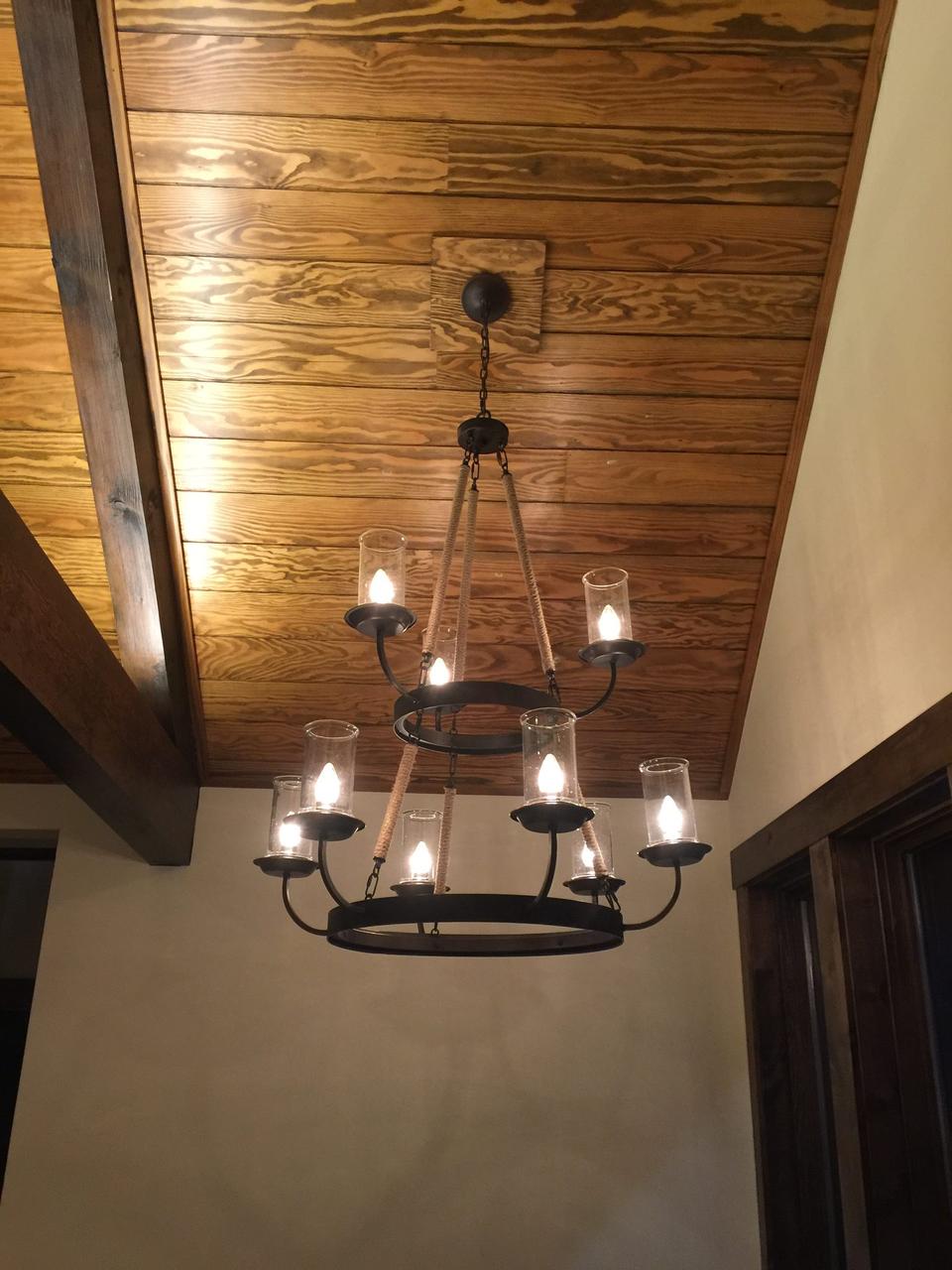 Two-tier forged-iron ring chandelier, built for a stairwell