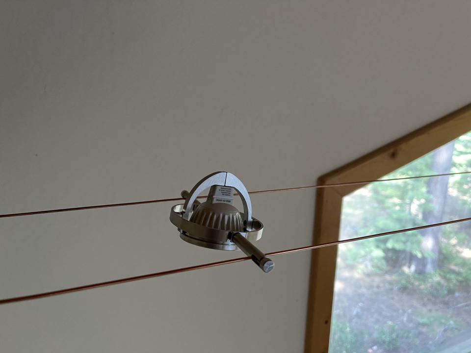Adjustable fixture on a tensioned copper cable run