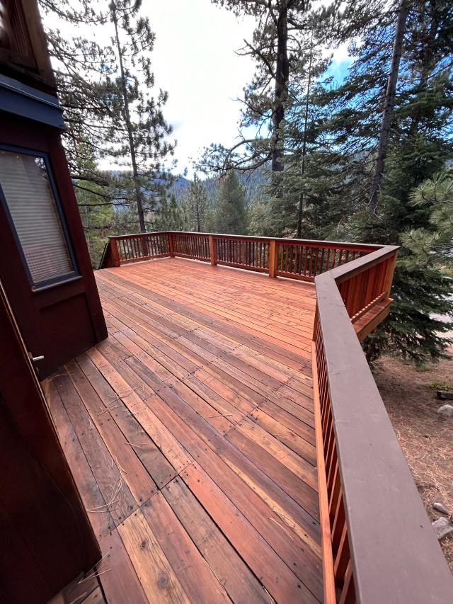 Wraparound redwood deck and railing with forested mountain views near Truckee