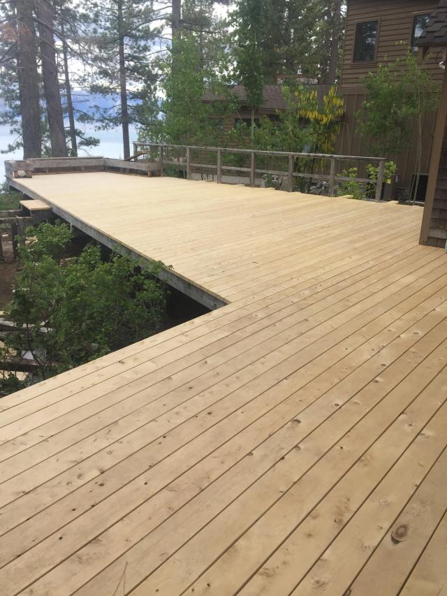 Freshly laid multi-level wood deck overlooking Lake Tahoe through the pines